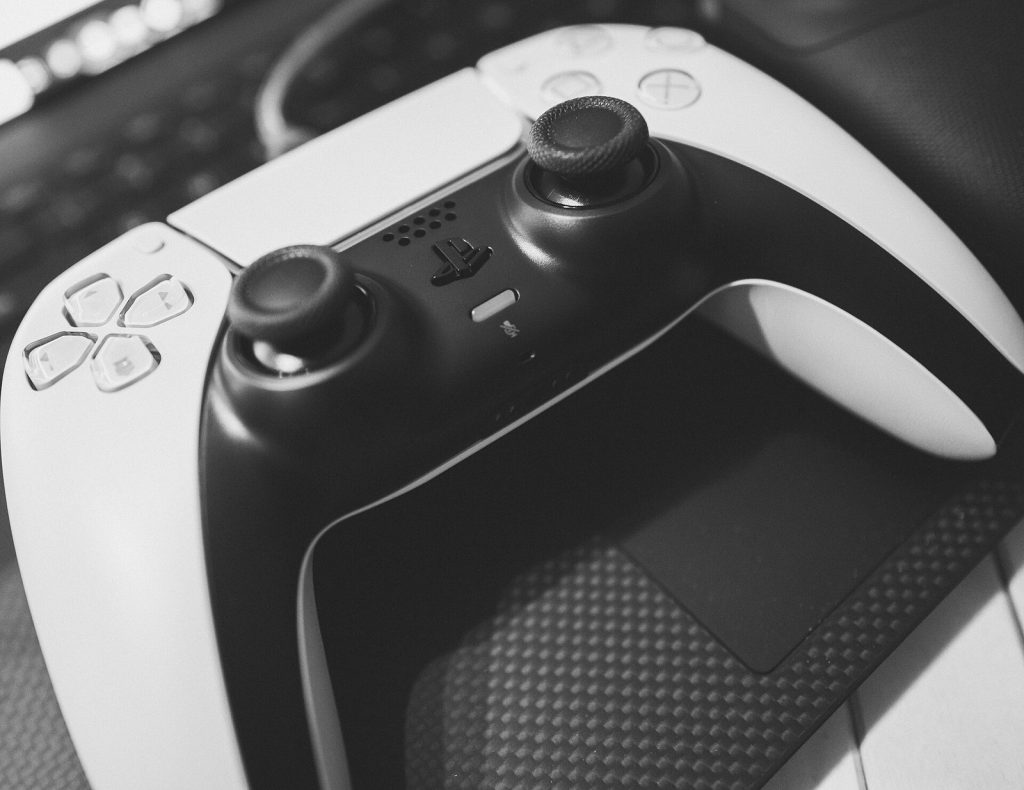 PlayStation 5 DualSense controller showing both analog sticks and buttons