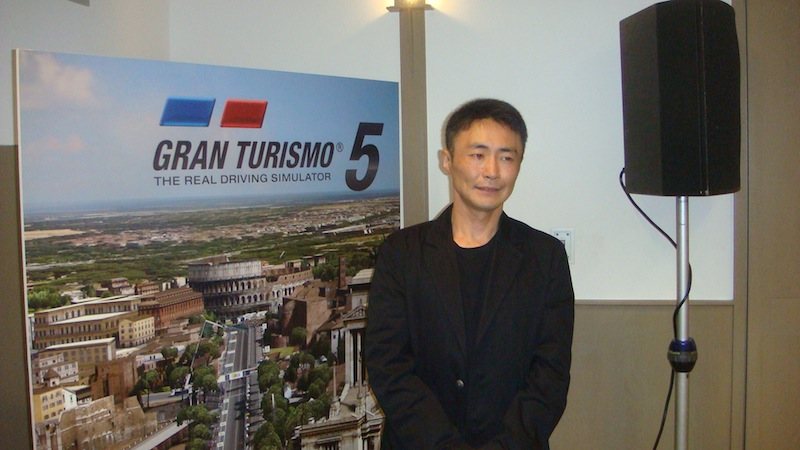 Kazunori Yamauchi on stage promoting Gran Turismo 5 at Tokyo Game Show 2010