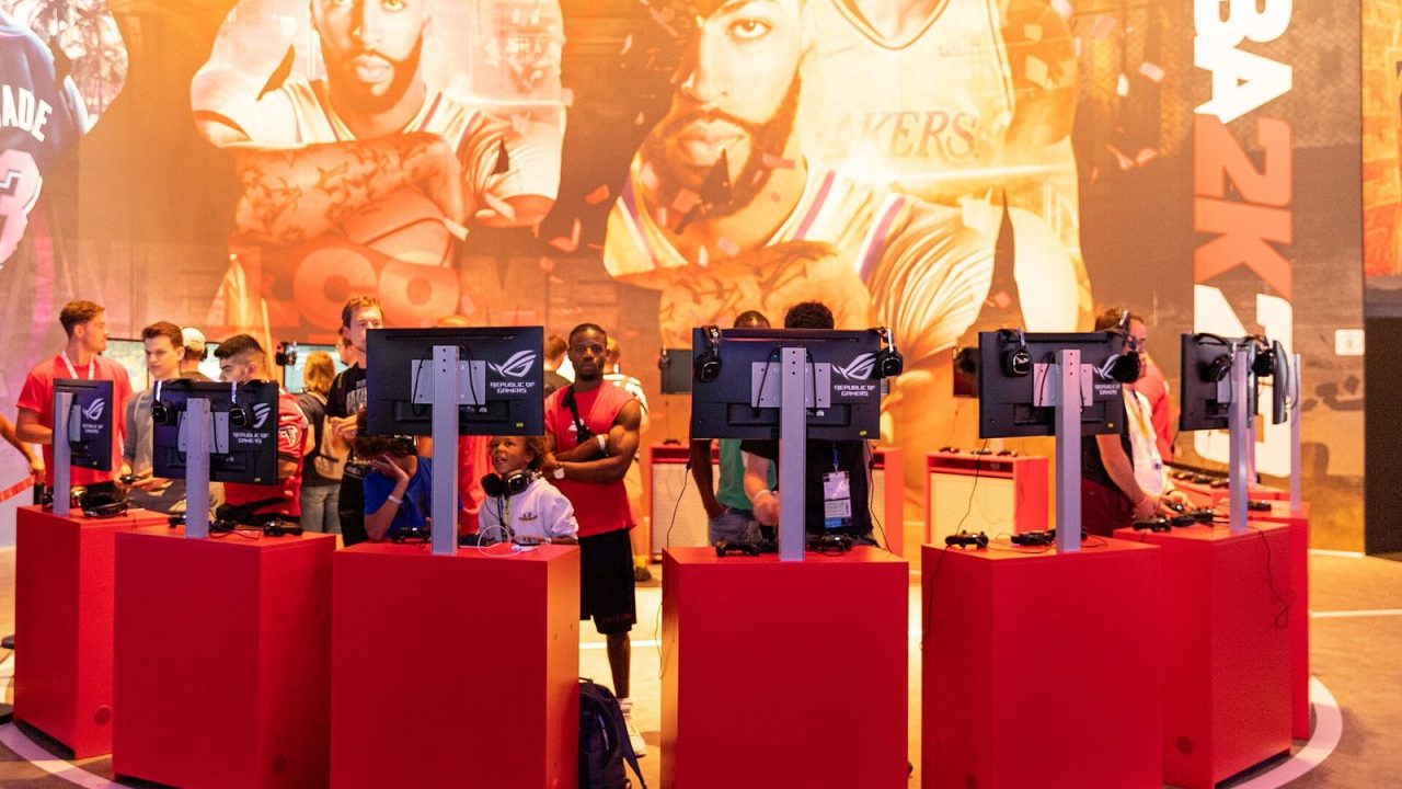 NBA 2K stand with players at game stations at Gamescom 2019 in Cologne