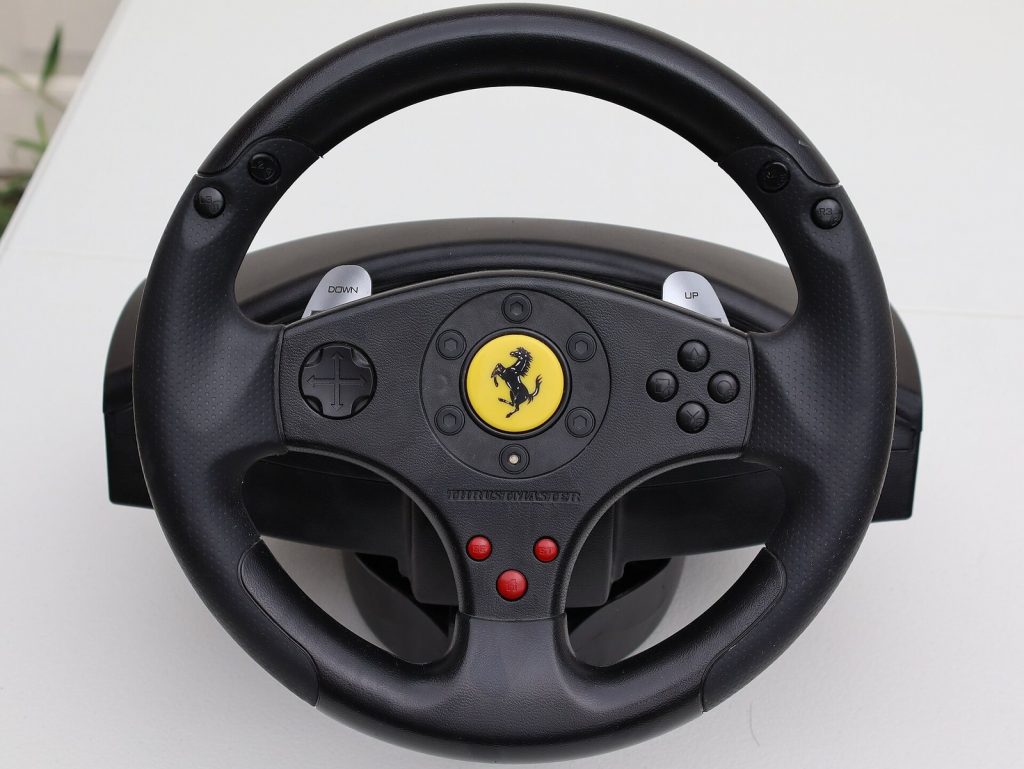 Front view of a Thrustmaster Ferrari GT Experience racing wheel controller